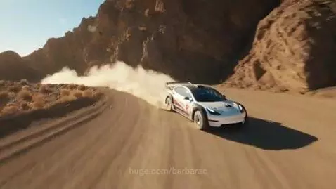 A white rally car drifts on a dirt road in a desert, creating a large dust cloud behind it under bright sunlight.