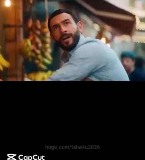 A small monkey sitting on a fruit stand, helping to arrange apples.