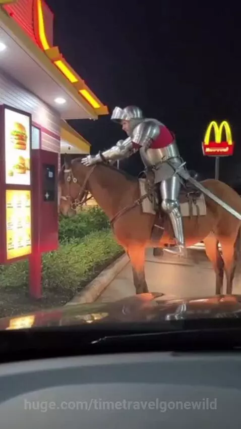 Medieval knight in full armor on a horse at a McDonald's drive-thru at night, approaching the speaker.