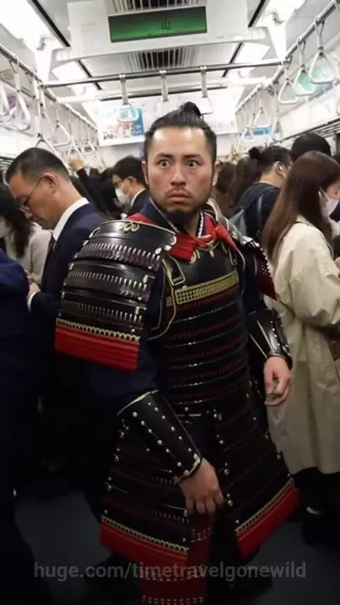 Man in samurai armor looking surprised on a crowded modern train during rush hour in Japan.