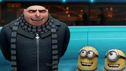 Animated character Gru, wearing a black coat and scarf, looks surprised as a yellow Minion fires a laser beam at him.