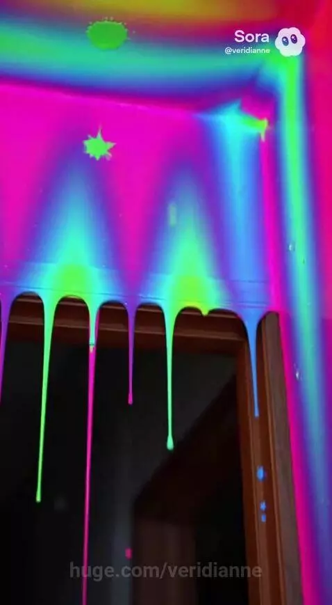 Woman covered in dripping rainbow paint walks through a surreal house.