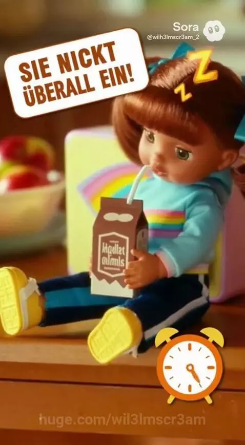 A young girl plays with Narcoleptic Nelly doll, which has a 'Z' on its head and a Nap Tracker.