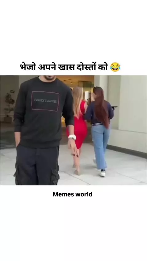 Man watches two women walk away, one in a red dress. Later, he dreams of her kissing him.