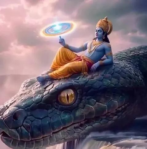 Lord Krishna with golden crown and yellow dhoti seated on Sheshnag's head, with a waterfall and cloudy sky.