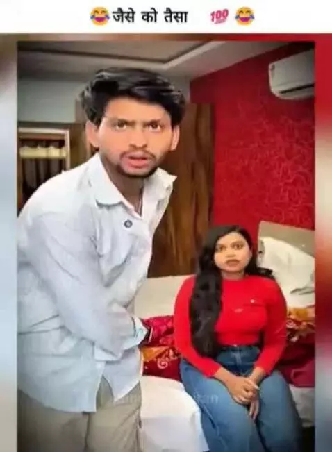 Man arguing with hotel staff over a bill, woman interjects with a witty remark.