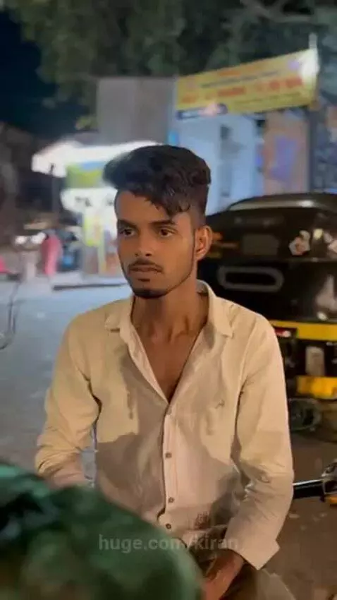 A transgender person in a green saree looks back as a street scene desaturates, implying a curse after a disrespectful encounter.