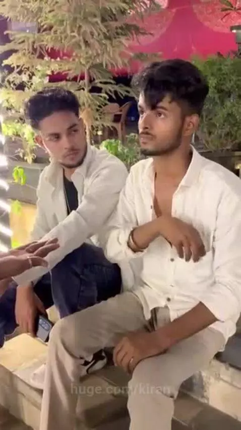 A transgender person in traditional Indian attire blesses a young man, who later celebrates topping his class.