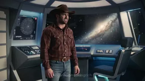 Cowboy in a plaid shirt and hat singing in a futuristic spaceship cockpit with a galaxy visible through the window.