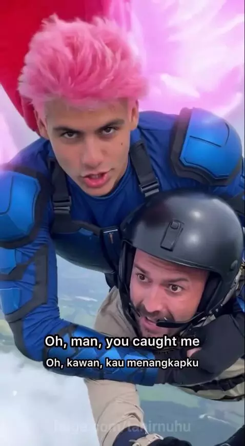 Superhero with pink wings catches a falling skydiver during a mid-air rescue.