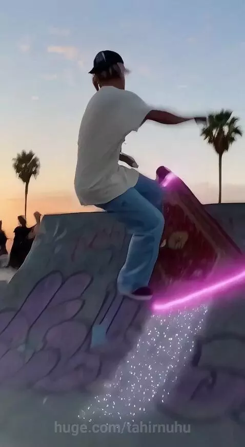 Skater performing a kickflip on a glowing magic carpet at sunset in a skate park.