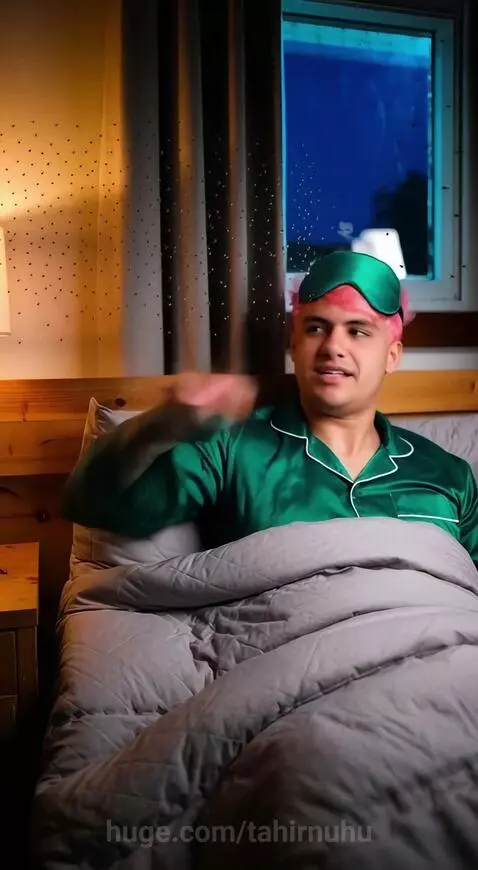 Man with pink hair in bed commands animated mosquitoes to push alarm clock out window.