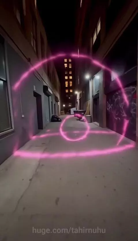 Man with pink hair in a trench coat confronts an intruder in a dark alley with glowing pink energy.