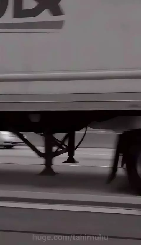 Charlie Chaplin's Tramp character dodging a robot attack on a highway.