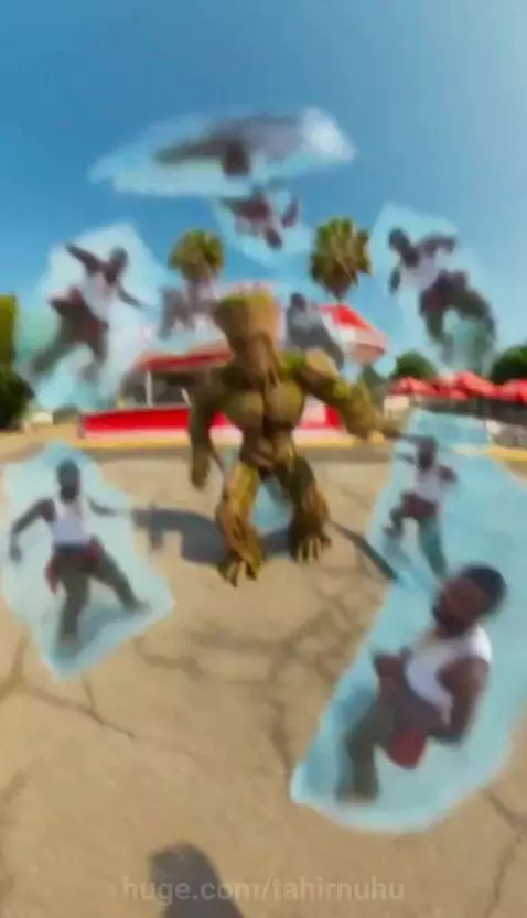 Man with glowing green eyes and bloody face confronts a large tree creature in a diner.