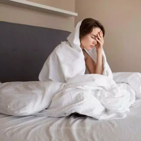 Montage of people struggling to sleep, staring at clocks, with symbolic imagery of insomnia.