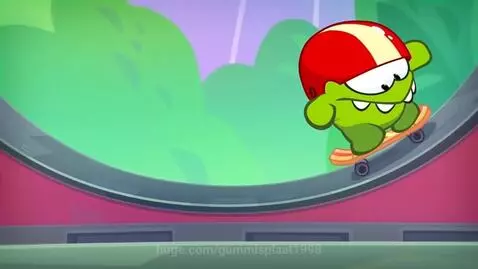 Om Nom the cartoon character skateboarding on a ramp, wearing a red helmet.
