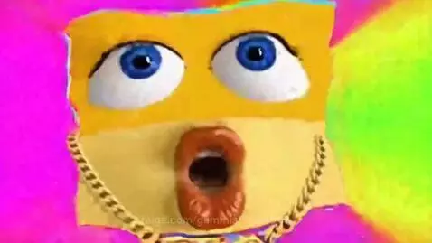 A yellow cardboard face with realistic eyes and lips, wearing pixelated sunglasses, against a colorful flashing background.