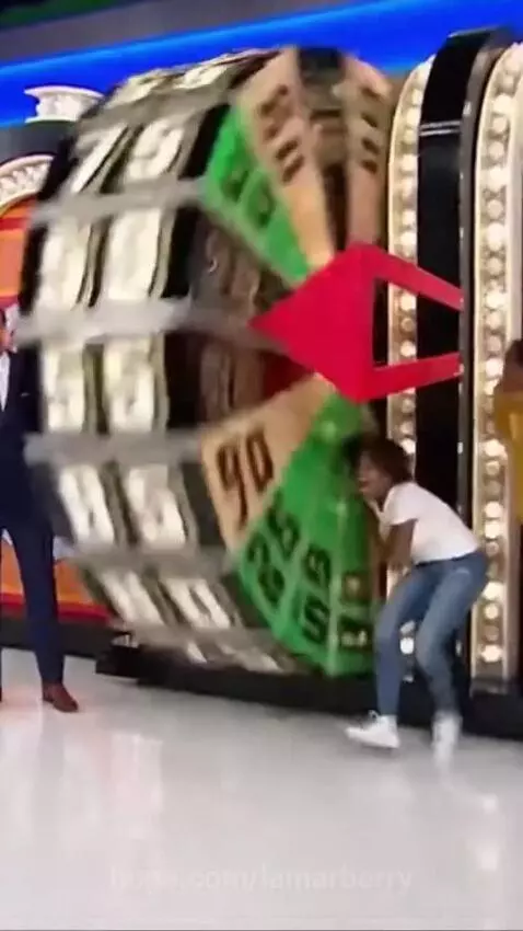 The Price Is Right's Big Wheel detaches and rolls away across the game show stage.