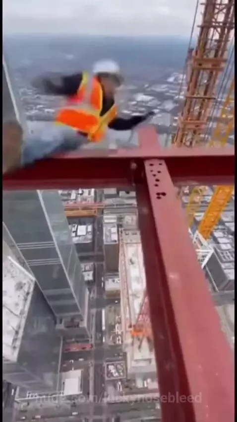 A man falls while working on the top of building by hassam