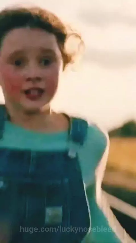 Young girl running on train tracks to save a small puppy from an approaching train.