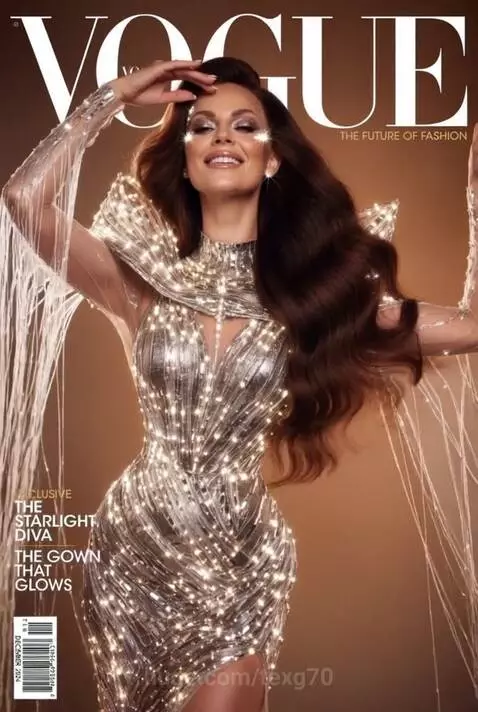 Two women in glowing, futuristic silver gowns posing for a Vogue magazine cover.