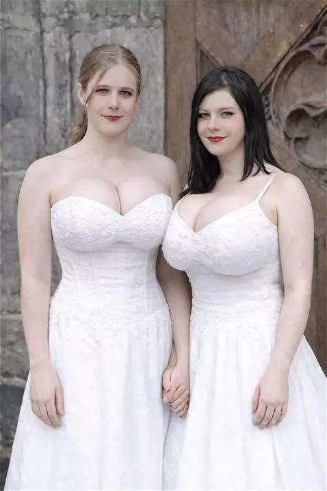 Two women in white dresses smiling, suggesting breast growth and enhancement.