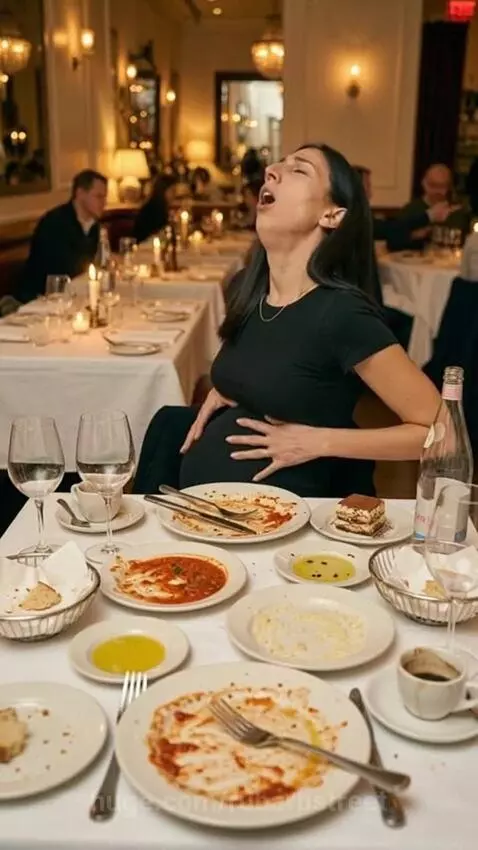 Woman with a full belly sitting at a restaurant table with many empty plates, rubbing her stomach in discomfort.