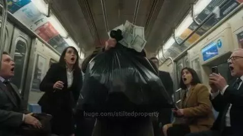 Man in subway car throws a bag of money, banknotes rain down on surprised passengers.