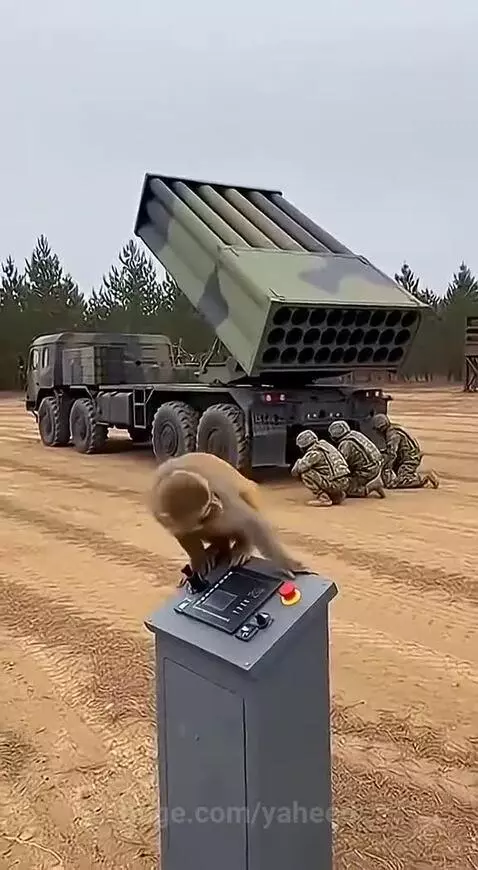 Monkey sitting on a military control panel with a red button, MLRS in background, smoke from launch.