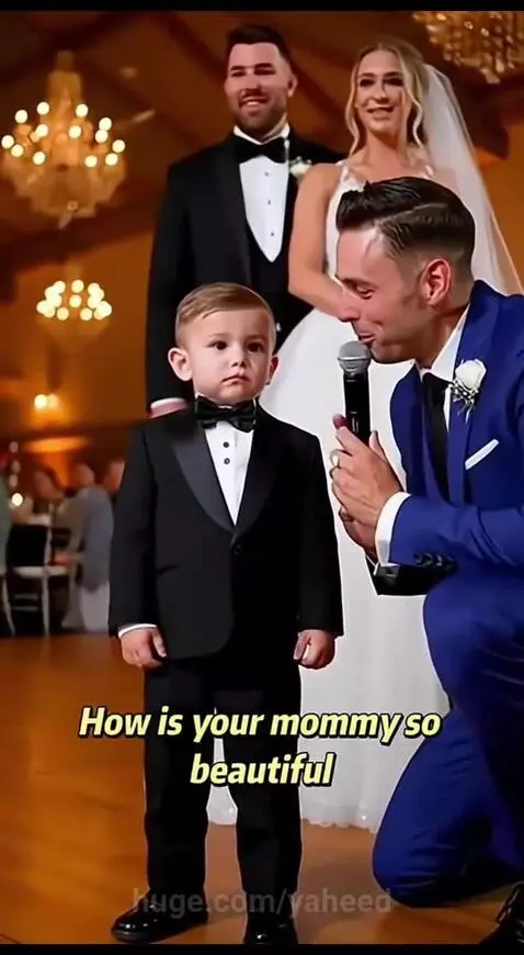 Young boy in tuxedo tells interviewer "It's the power of makeup" why his mom is beautiful.