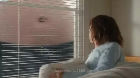 Woman shocked to see a giant human belly filling her window frame upon waking up.