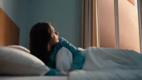 Woman in bed looking shocked at a giant pregnant belly outside her window.