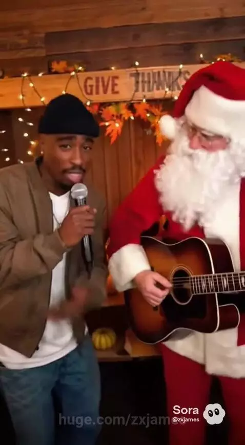 Tupac impersonator singing into a mic next to Santa Claus playing guitar, with Thanksgiving decorations.