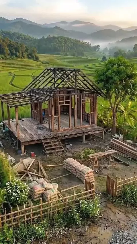 Dilapidated wooden house transformed into a charming home with a lush garden.