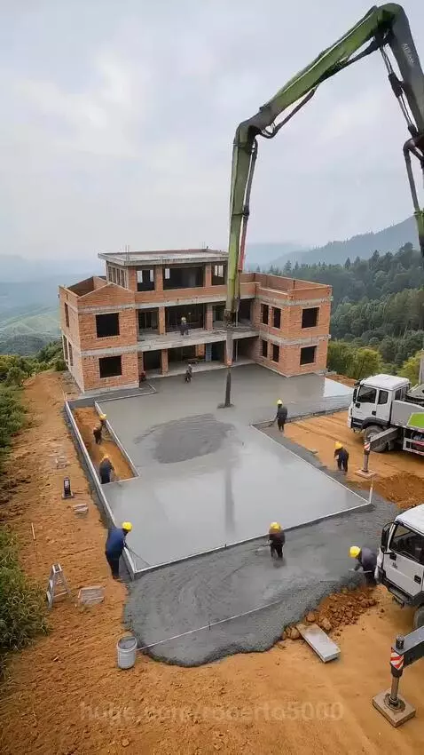 Timelapse of a traditional Chinese-style house being built on a hillside with mountain views.