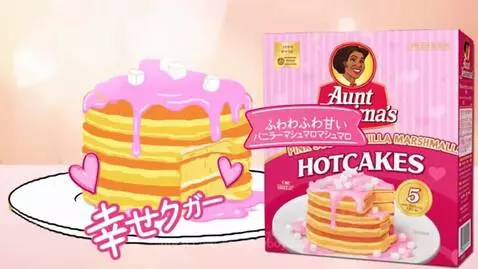 Animated girl happily eating pink frosted pancakes with marshmallows.