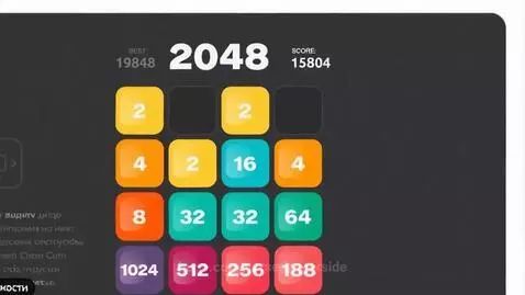 Screen recording of a dark-themed puzzle game with brightly colored numbered tiles merging.