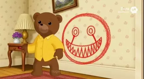 Cartoon bear cub drawing a red smiley face with sharp teeth on a patterned wall, then hiding.