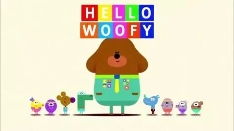 Duggee the dog character with the Squirrels below, colorful blocks displaying 'HELLO WOOFY' and other greetings.