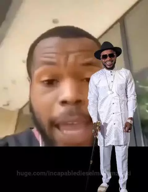 Man with beard speaks to camera while smiling man in white outfit and sunglasses holds a walking stick.