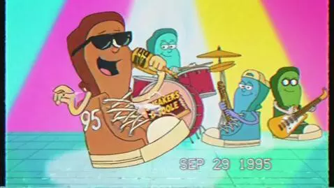 Anthropomorphic sneakers band performing on a colorful stage in a 1995 commercial for Sneakers O'Toole candy.