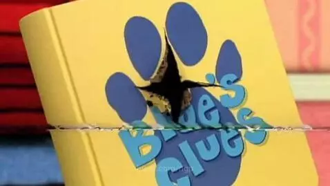 A yellow book with a blue paw print glitches and melts, revealing a dark void with oozing oil.