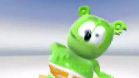 Animated green gummy bear wearing striped underwear, dancing with arms outstretched against a blue and white background.