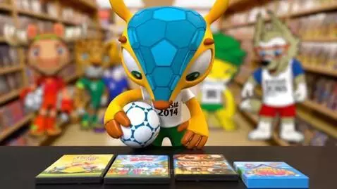 Fuleco the armadillo mascot for the 2014 FIFA World Cup holding a soccer ball.